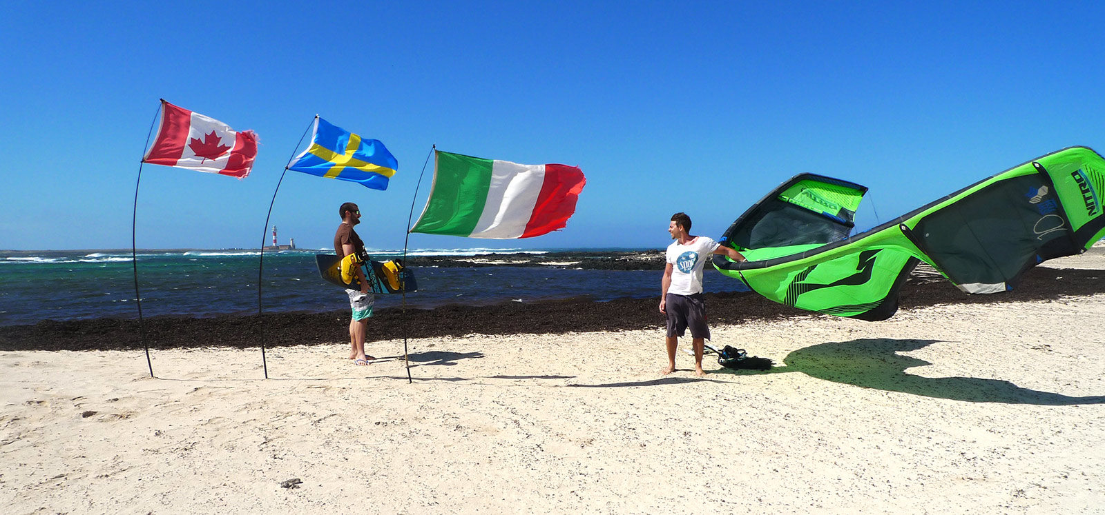 Three flags on the beach of the Boston lagoon