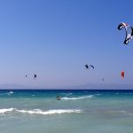Kitesurfing on blue water