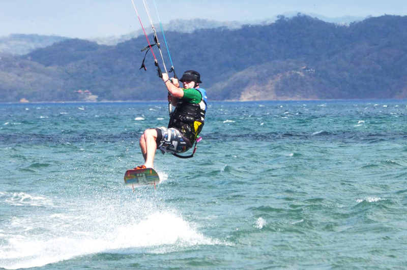 Ken doing a jump while kitesurfing in Bahia Salinas, Costa Rica.