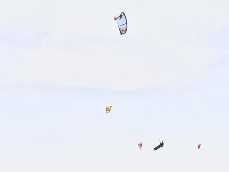 Kitelement Re Solve split kiteboard among kites in the sky.