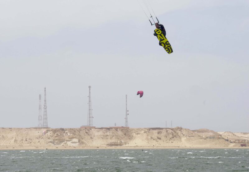 Kitelement Re Solve split kiteboard tweaked front grab.