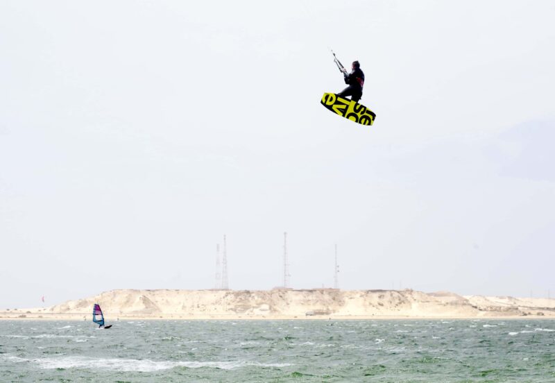 Kitelement Re Solve split kiteboard flying high.