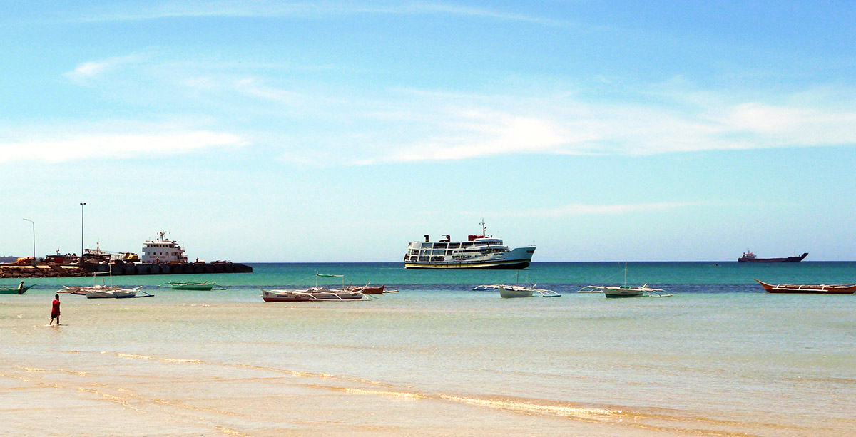 Ferry arriving at the pier of Cuyo.