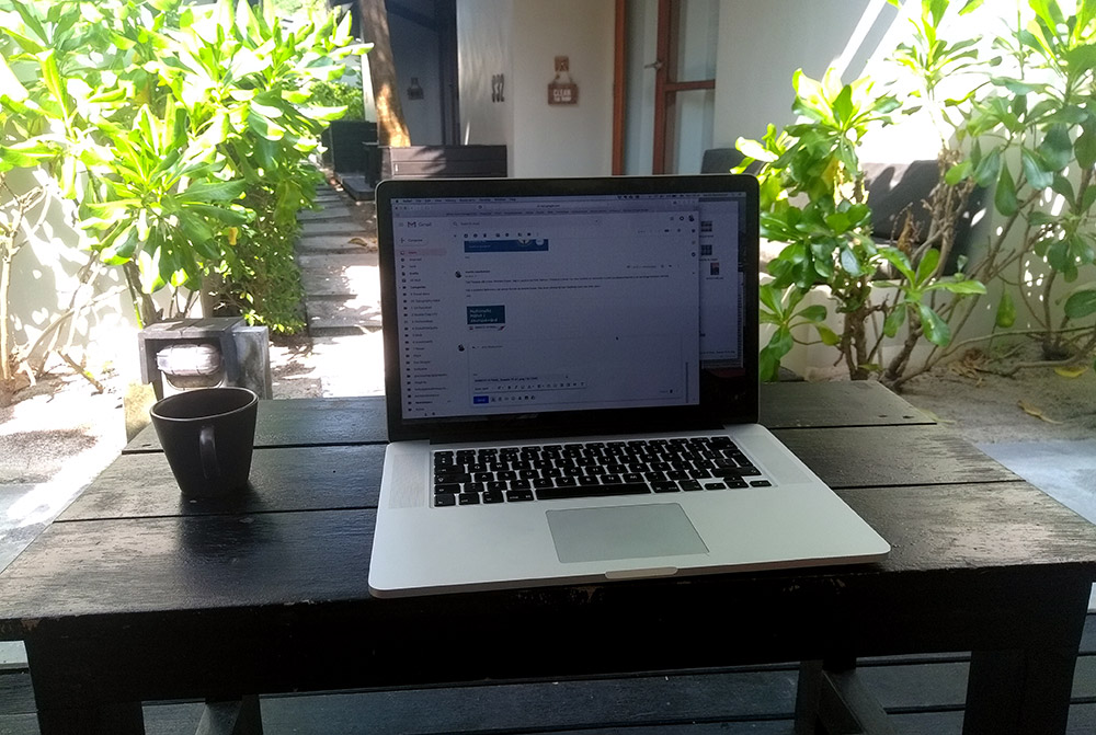 Laptop outside bungalow