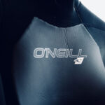 Close-up of O'Neill logo on wetsuit.